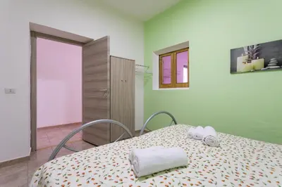 Letto o letti in una camera di Casa Nonno
