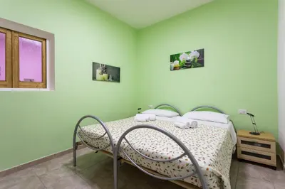 Letto o letti in una camera di Casa Nonno