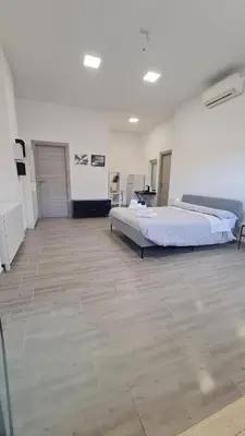 Letto o letti in una camera di Via Contu