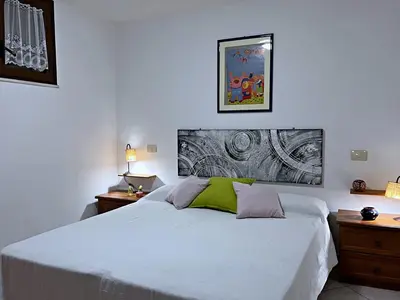 Letto o letti in una camera di casa bellavista