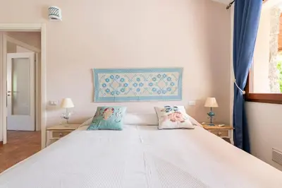 Letto o letti in una camera di Prestigiosa Villa a Chia - Parcheggio riservato