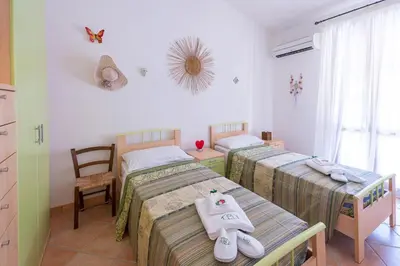 Letto o letti in una camera di Villetta Corallina (service fee waived)