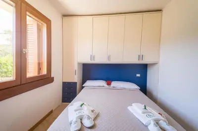 Letto o letti in una camera di Villa Ajò - Is Molas (service fee waived)