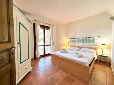 Letto o letti in una camera di Villa Tamaris, Campulongu walk to private beach