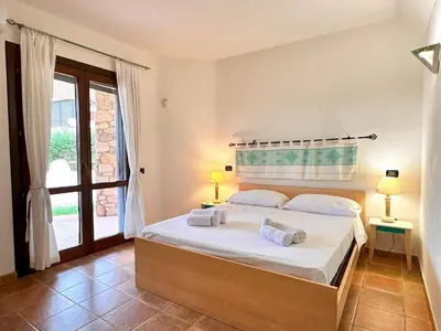 Letto o letti in una camera di Villa Tamaris, Campulongu walk to private beach
