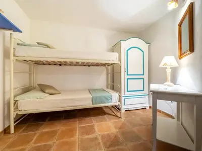 Letto o letti in una camera di Villa Tamaris, Campulongu walk to private beach