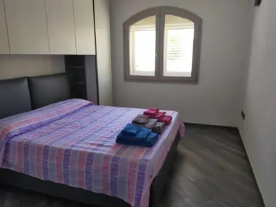 Letto o letti in una camera di IL GLICINE D'OGLIASTRA APARTAMENT