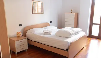 Letto o letti in una camera di Nel cuore di Oristano