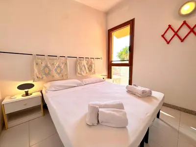 Letto o letti in una camera di Patio on the Simius beach - 300 mt from beach