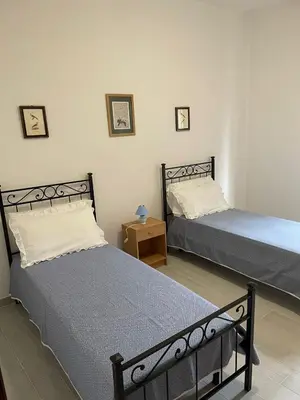 Letto o letti in una camera di Casa Beatrice