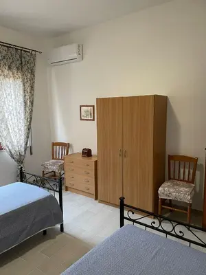 Letto o letti in una camera di Casa Beatrice