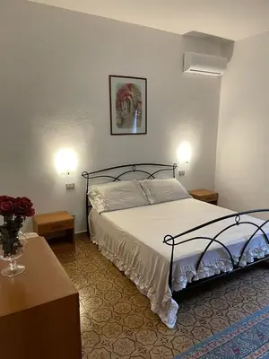 Letto o letti in una camera di Casa Beatrice