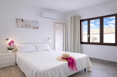 Letto o letti in una camera di Bonòra Suites