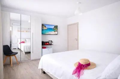 Letto o letti in una camera di Bonòra Suites