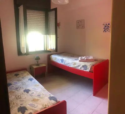 Letto o letti in una camera di Casa vacanze a due passi dal Poetto