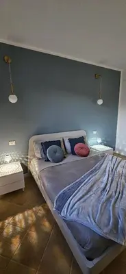 Letto o letti in una camera di Chia Sweet Home