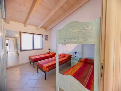 Letto o letti in una camera di Domu Imbirdi - Vista panoramica sul mare