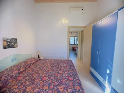 Letto o letti in una camera di Domu Imbirdi - Vista panoramica sul mare