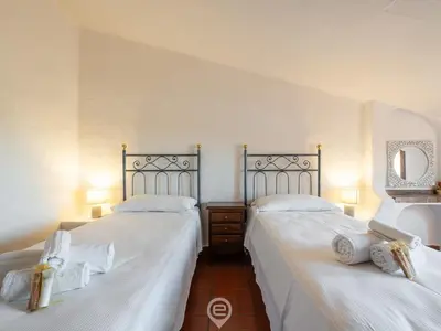 Letto o letti in una camera di Villa La Perla