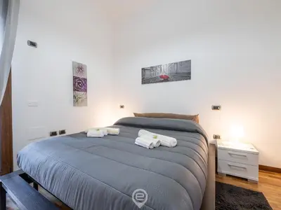 Letto o letti in una camera di Colombo Avenue Charm