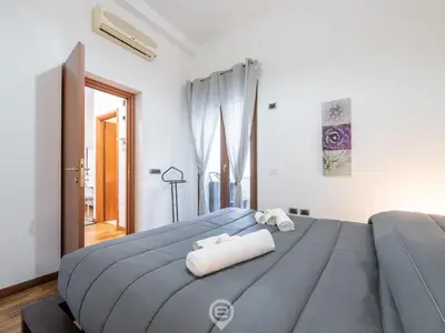 Letto o letti in una camera di Colombo Avenue Charm