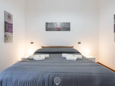 Letto o letti in una camera di Colombo Avenue Charm