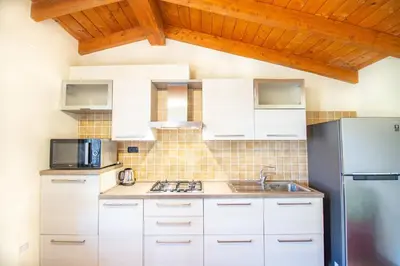 Cucina o angolo cottura di Chelu & Mare con terrazza e vista panoramica