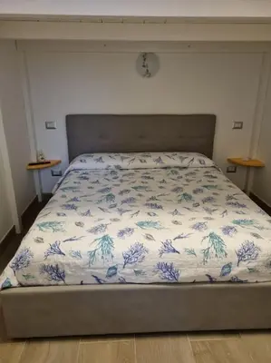 Letto o letti in una camera di Gina House (20 metri dal mare)