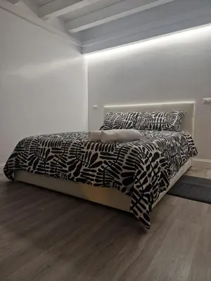 Letto o letti in una camera di Space Suite Marina