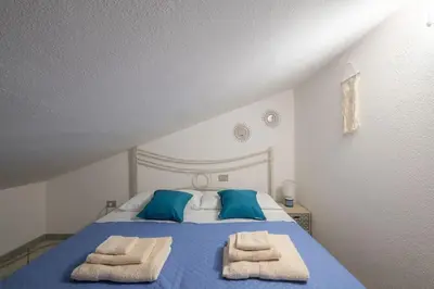 Letto o letti in una camera di Comfort a 4 minuti dal mare- Giardino e bbq