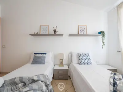 Letto o letti in una camera di Pan Home
