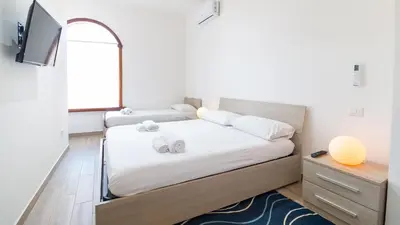 Letto o letti in una camera di Appartamento il Maestrale Casa Vacanza