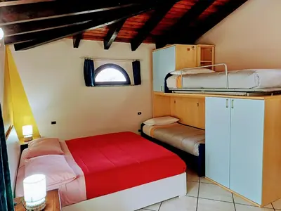 Letto o letti in una camera di Monti e Mare