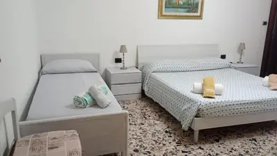 Letto o letti in una camera di Casa Bonaria - IUN R 6698