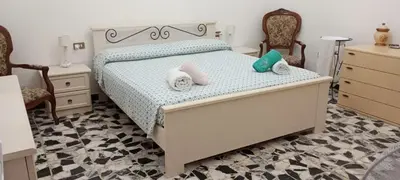 Letto o letti in una camera di Casa Bonaria - IUN R 6698