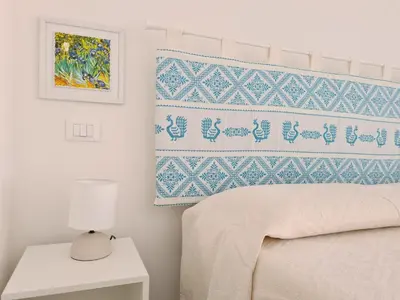 Letto o letti in una camera di Ma.Vi Casa Vacanze