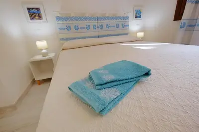 Letto o letti in una camera di Ma.Vi Casa Vacanze