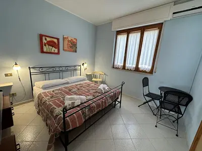 Letto o letti in una camera di Appartamento a 50 metri dal mare a Maladroxia C36