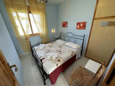 Letto o letti in una camera di Appartamento a 50 metri dal mare a Maladroxia C36
