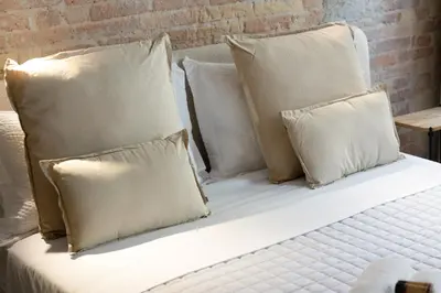 Letto o letti in una camera di Trinità UrbanNest - Cuore di Cagliari