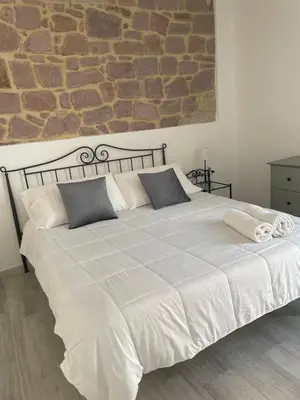 Letto o letti in una camera di ucuppu appartamenti Civico16