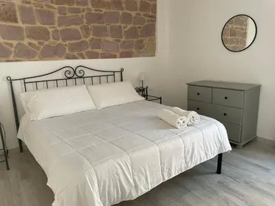 Letto o letti in una camera di ucuppu appartamenti Civico16
