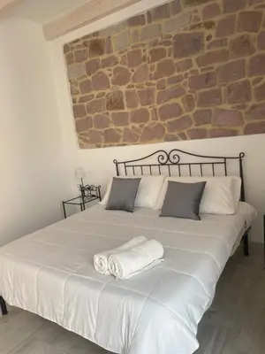 Letto o letti in una camera di ucuppu appartamenti Civico16
