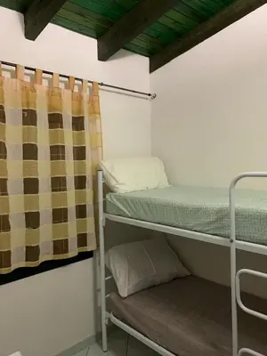 Letto o letti in una camera di Su Giardinu
