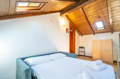 Letto o letti in una camera di Palazzo Boyer - Marina - 6 posti