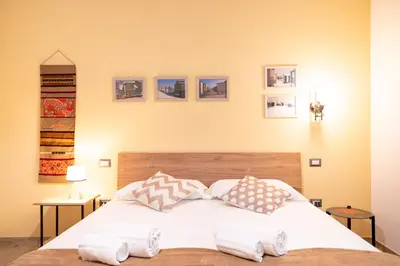 Letto o letti in una camera di Harmony - Via Bottego - Fra centro storico e mare