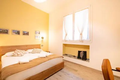 Letto o letti in una camera di Harmony - Via Bottego - Fra centro storico e mare