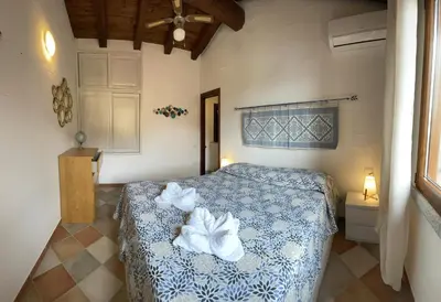 Letto o letti in una camera di L'Alba Chiara Tanca Piras
