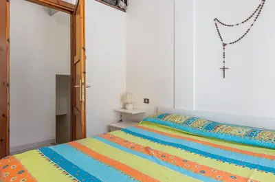 Letto o letti in una camera di GuestHost - Il Mandorleto Villasimius Roomy Apt