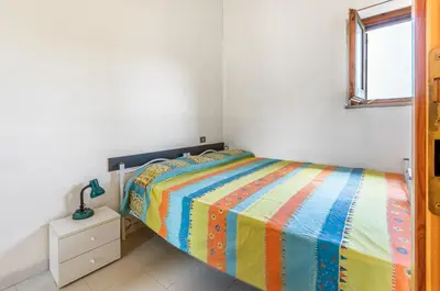 Letto o letti in una camera di GuestHost - Il Mandorleto Villasimius Roomy Apt